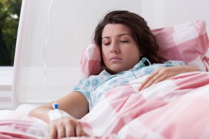 Young woman having intravenous therapy